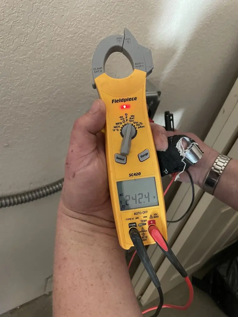 Voltage testing with clamp meter during Generator Installation in Rock Valley